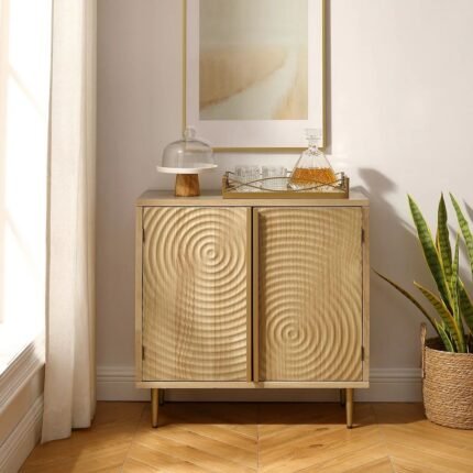 A natural wood cabinet featuring two doors with unique 3D spiral carvings and gold-toned tapered legs - Modera Furnish.