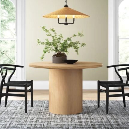 Solid wood round pedestal dining table with matte natural finish in contemporary style - Modera Furnish