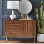 A walnut finish solid wood mid-century modern sideboard featuring three drawers and a side cabinet on tapered legs - Modera Furnish.