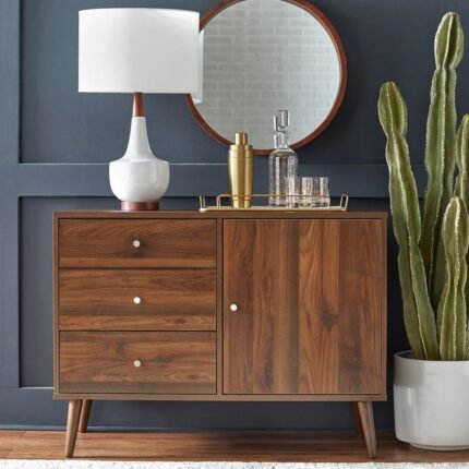 A walnut finish solid wood mid-century modern sideboard featuring three drawers and a side cabinet on tapered legs - Modera Furnish.