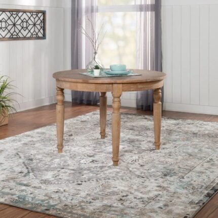 Round solid wood dining table in natural brown finish with classic legs and contemporary style – Modera Furnish.