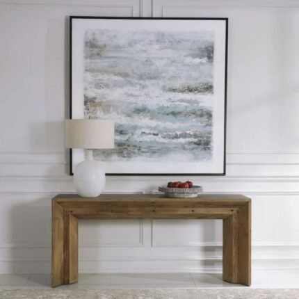 A long gray solid wood console table with a thick minimalist waterfall edge frame styled with a white lamp and artwork - Modera Furnish