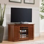 Solid wood corner TV stand with glass-front cabinet and oak finish for space-efficient living rooms – Modera Furnish