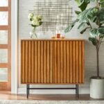 Exquisite mid-century solid wood bar cabinet with slatted doors, wine cubbies, and glass racks on metal base by Modera Furnish.