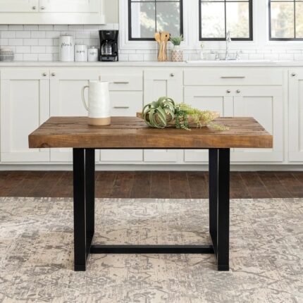 Distressed solid wood dining table in rustic oak finish with industrial metal base – Modera Furnish.