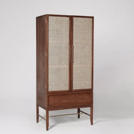 A natural honey solid acacia wardrobe featuring two hand-woven cane doors and a single base storage drawer - Modera Furnish.