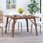 Contemporary solid wood dining table with sculpted base and walnut finish in a modern design – Modera Furnish