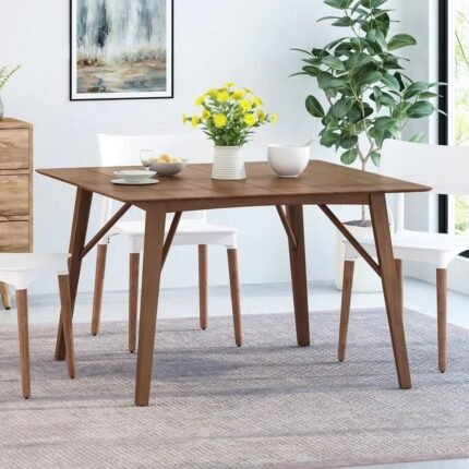 Contemporary solid wood dining table with sculpted base and walnut finish in a modern design – Modera Furnish