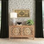 A natural finish solid wood cabinet featuring two large hand-carved floral doors and integrated storage shelving - Modera Furnish.