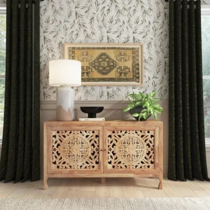 A natural finish solid wood cabinet featuring two large hand-carved floral doors and integrated storage shelving - Modera Furnish.