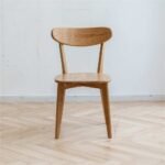 Modern solid wood oak dining chair with natural finish and curved backrest for dining spaces - Modera Furnish